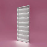 Beleuchteter PIXLIP POP Rahmen auf rosa Hintergrund ohne Stoffbanner– freistehend mit LED-Licht für hinterleuchtete Werbegrafiken.