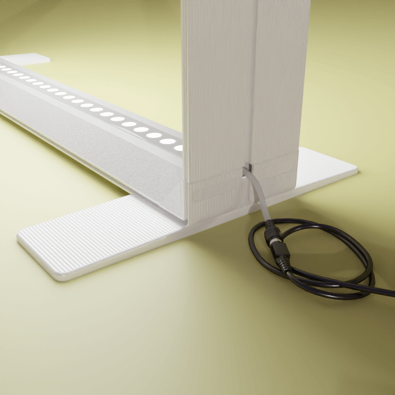 Detailansicht des PIXLIP GO Counter S ohne Textildruck: Fokus auf den stabilen Standfuß mit integriertem LED-Lichtsystem und angeschlossenem Netzkabel.