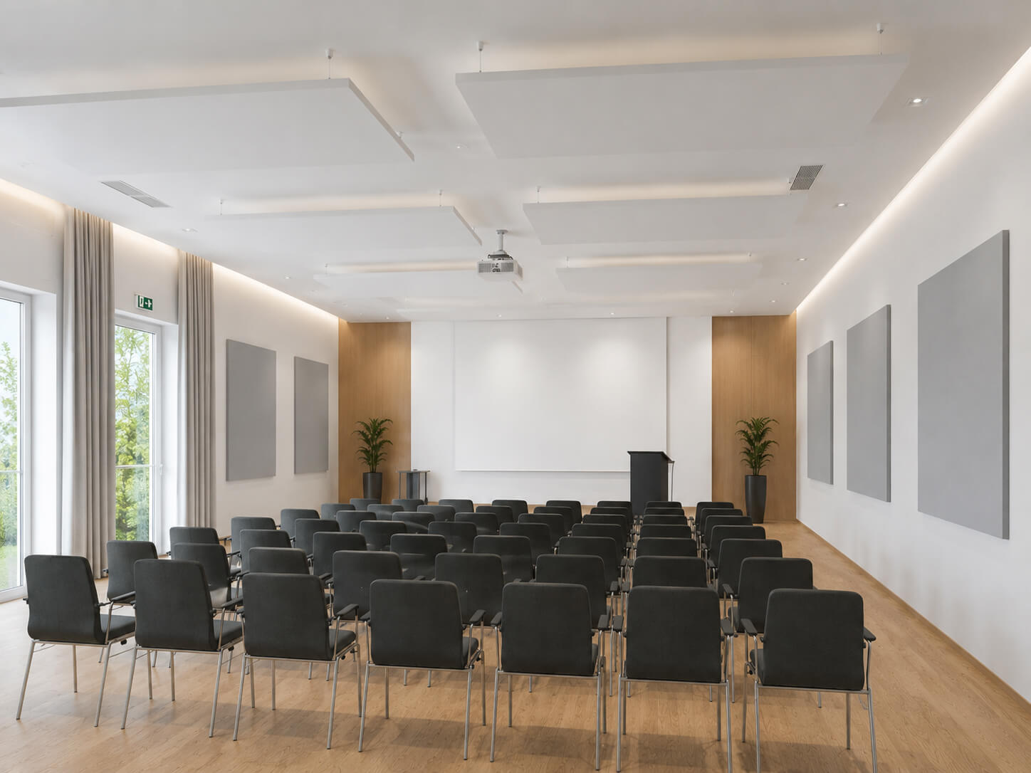 Akustik-Deckensegel und Akustikbilder in einem Veranstaltungsraum zur Reduzierung von Nachhall und Verbesserung der Sprachverständlichkeit.